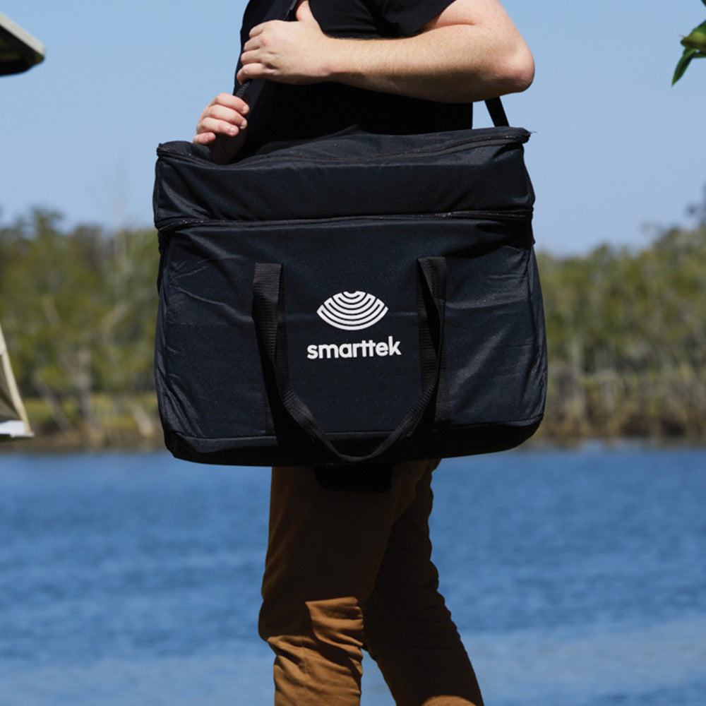 Person carrying a Smarttek Black carry bag using the shoulder strap.