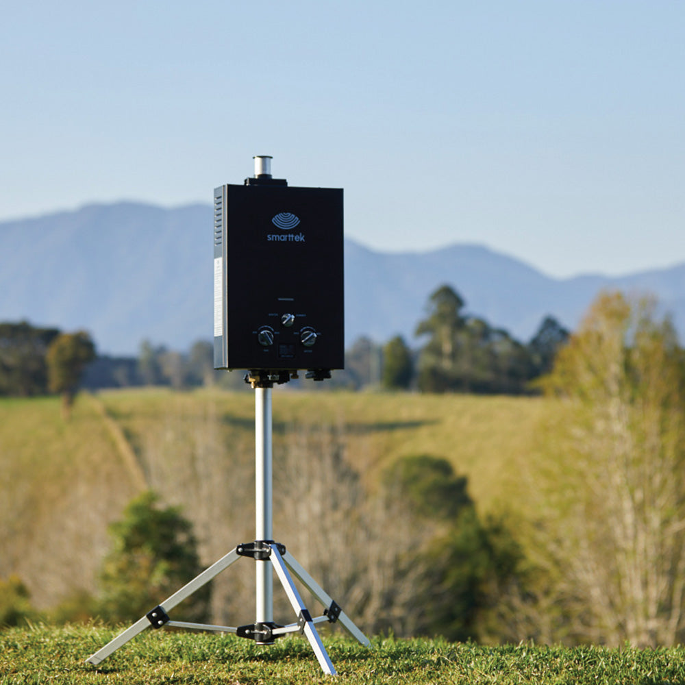 Smarttek tripod stand set up outdoors with a hot water unit mounted.